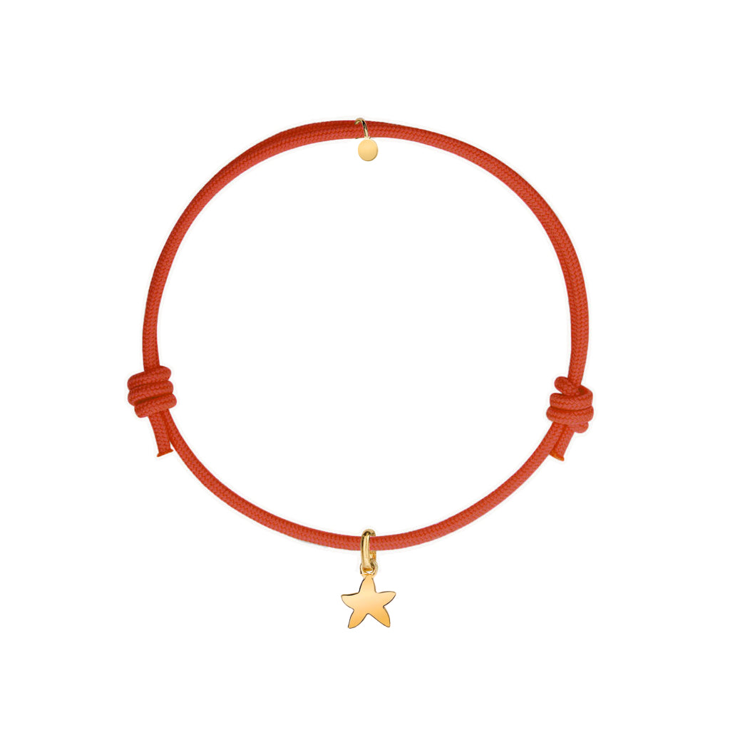 bracciale col cordino rosso e ciondolo stella marina oro